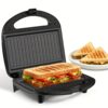 Two-Slice Grilled Cheese Sandwich Maker Featuring Non-Stick Grilling Surfaces, Indicator Lights, a Cool-Touch Handle, And Easy Cleaning And Storage, with a Power of 750 Watts.